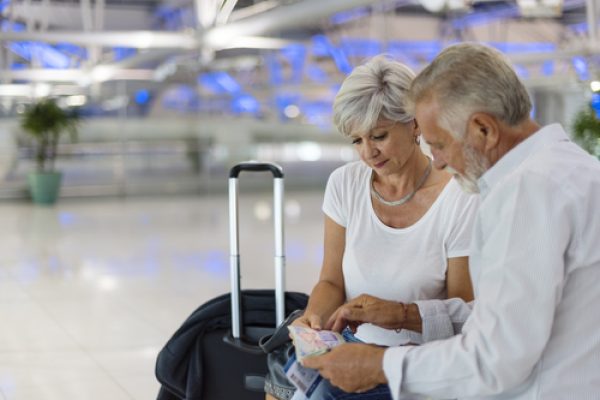 Senior,Couple,Traveling,Airport,Scene