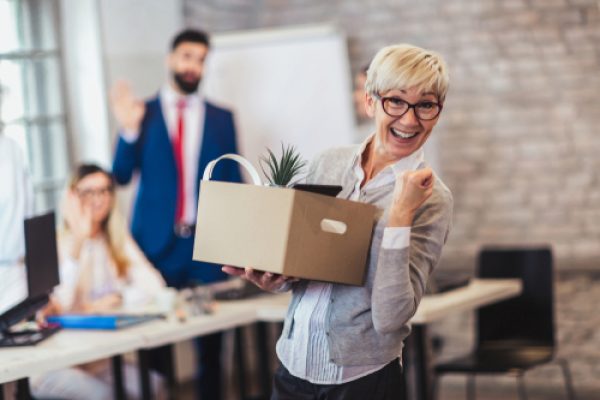 Elderly,Employee,Leaving,Office,With,Box,Full,Of,Belongings.,Time