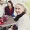 Portrait smiling senior woman at patio table